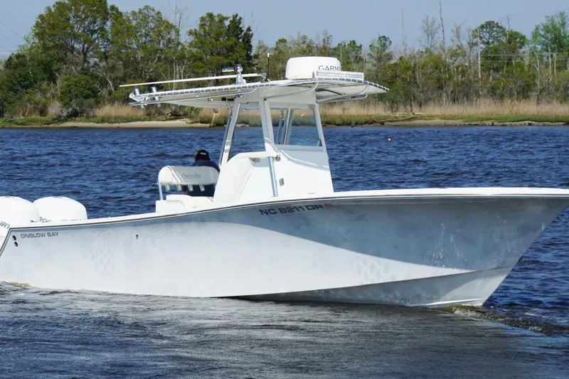 Slide: The Image of 2011 Onslow Bay 27 Offshore boat cruising on a calm river. - 6