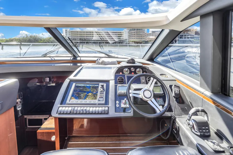 Slide: The Image of Interior view of the helm console on a 2013 Princess V57 yacht. - 11