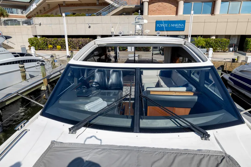 Slide: The Image of 2013 Princess V57 yacht docked at marina, front view. - 26