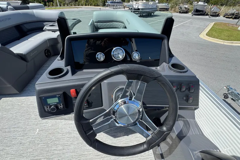 Slide: The Image of 2026 Bennington 22 SSR boat dashboard with steering wheel and control panel. - 9