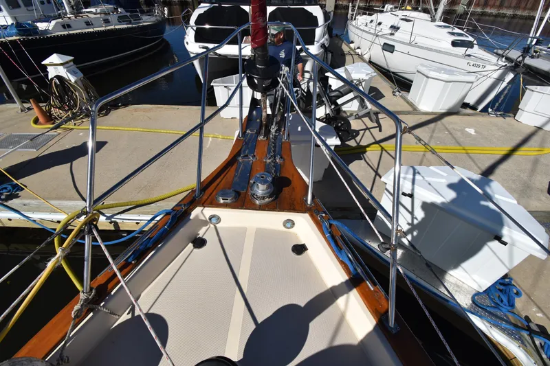 Slide: The Image of Bow view of 1999 Island Packet 380 sailboat docked at marina. - 13