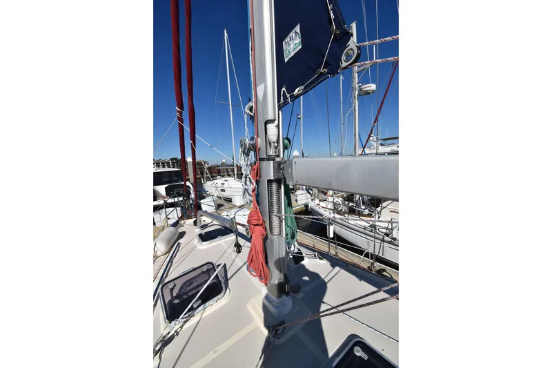 Slide: The Image of Sailboat deck view of 1999 Island Packet 380, featuring mast and rigging. - 15