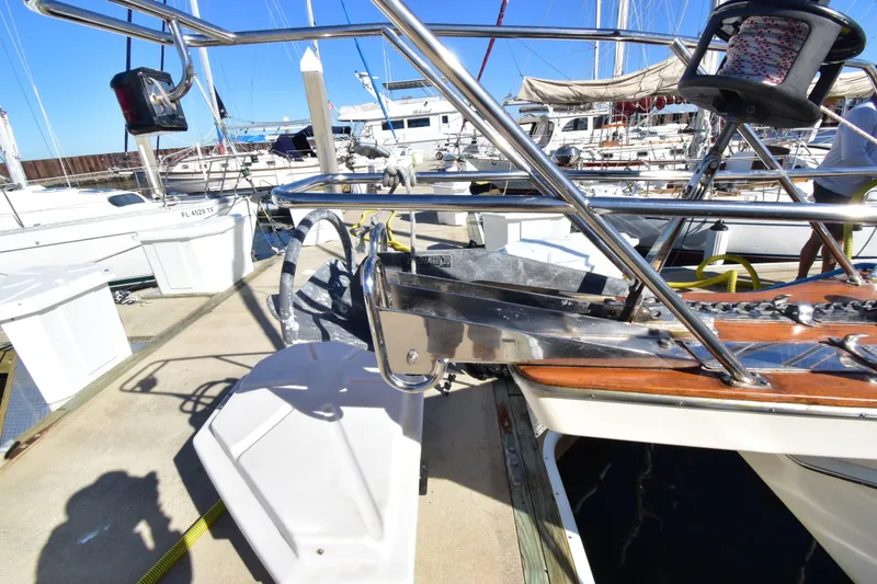 Slide: The Image of Island Packet 380 sailboat docked, showcasing anchor and deck details, 1999 model. - 3