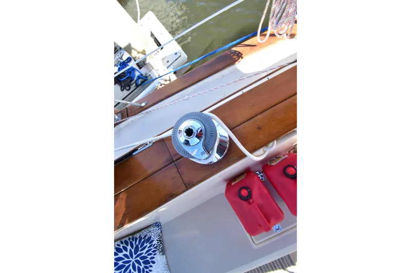 Slide: The Image of Deck view of a 1999 Island Packet 380 sailboat with winch and fuel containers. - 8