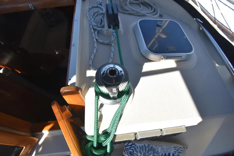 Slide: The Image of Deck of 1999 Island Packet 380 sailboat with winch, ropes, and hatch. - 9