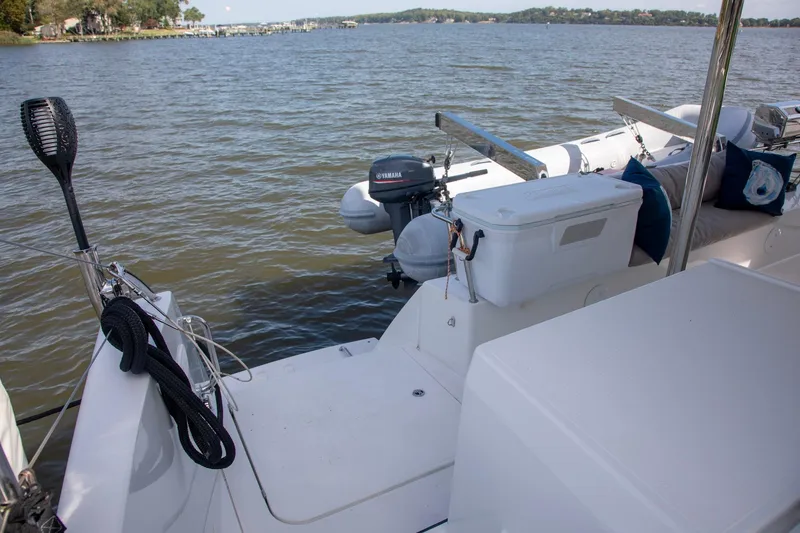 Slide: The Image of 2018 Fountaine Pajot Helia 44 Evolution yacht with Yamaha motor and seating area. - 14