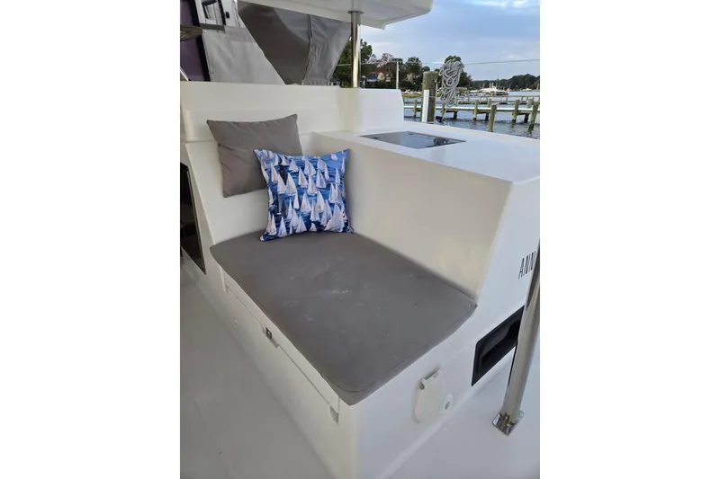 Slide: The Image of Cozy seating area on 2018 Fountaine Pajot Helia 44 Evolution catamaran with decorative pillows. - 16