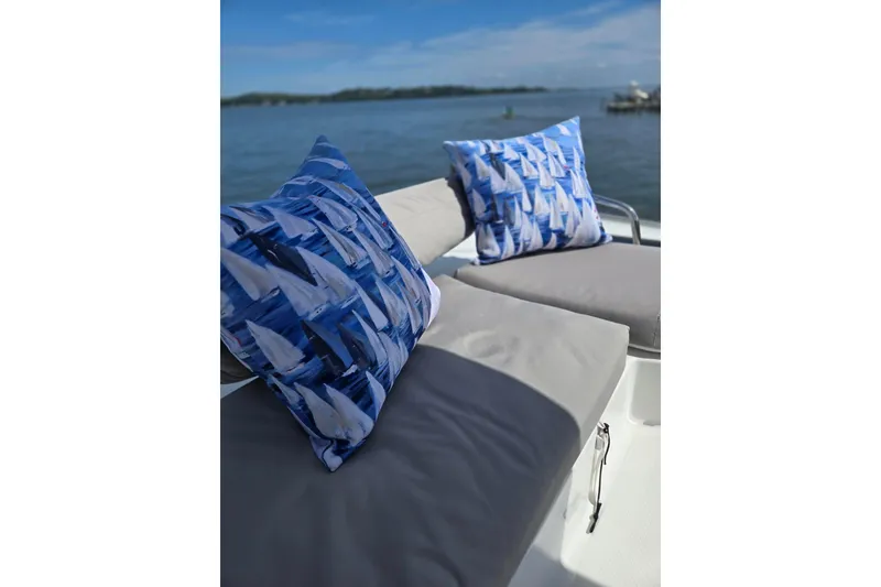 Slide: The Image of Luxurious seating on 2018 Fountaine Pajot Helia 44 Evolution catamaran with nautical-themed cushions. - 17