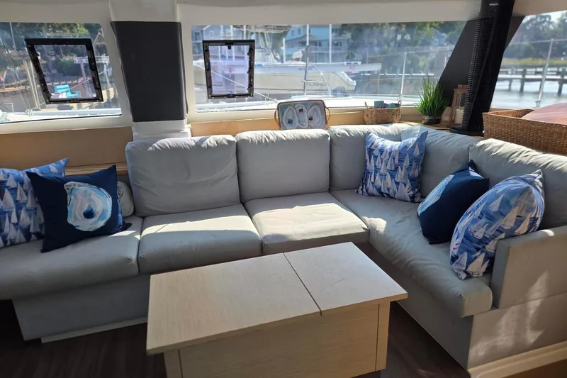 Slide: The Image of Luxurious interior of 2018 Fountaine Pajot Helia 44 Evolution catamaran with cozy seating and nautical decor. - 18