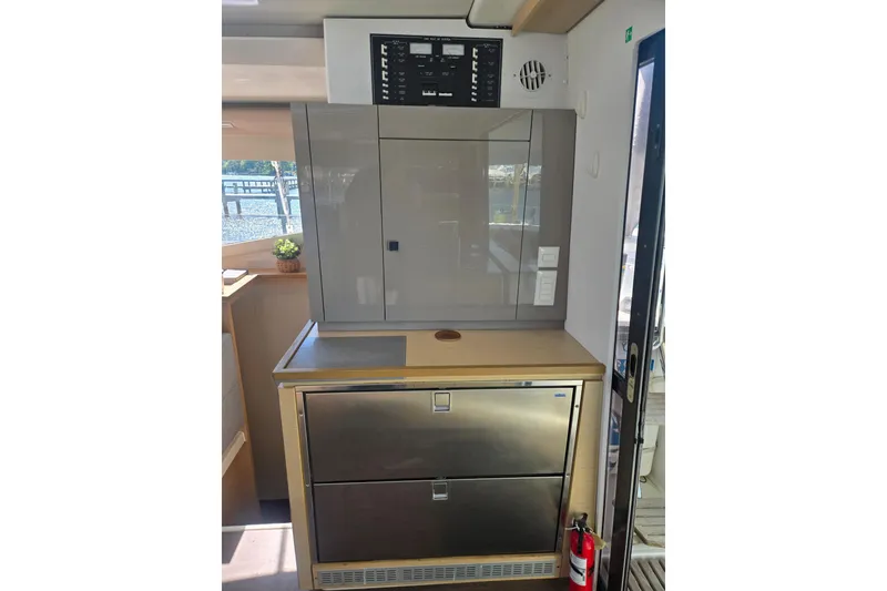 Slide: The Image of Interior of 2018 Fountaine Pajot Helia 44 Evolution yacht, featuring modern kitchen appliances. - 31