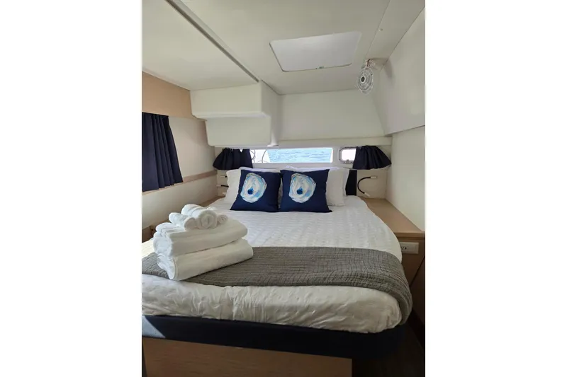 Slide: The Image of Luxurious cabin interior of 2018 Fountaine Pajot Helia 44 Evolution catamaran with cozy bedding. - 35