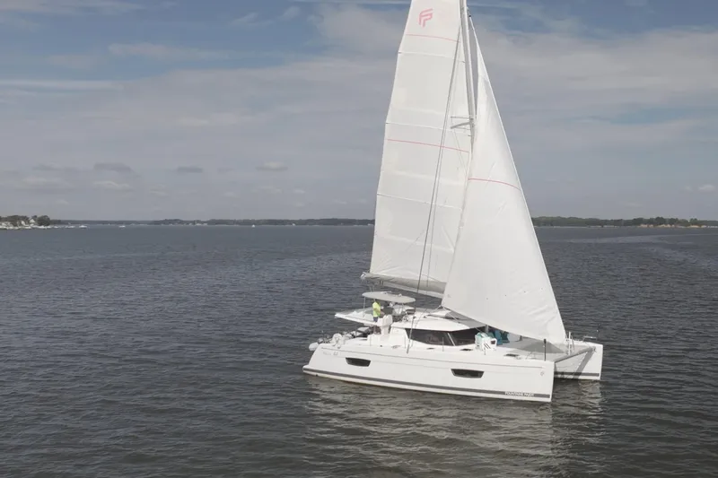 Slide: The Image of 2018 Fountaine Pajot Helia 44 Evolution catamaran sailing on open water. - 5