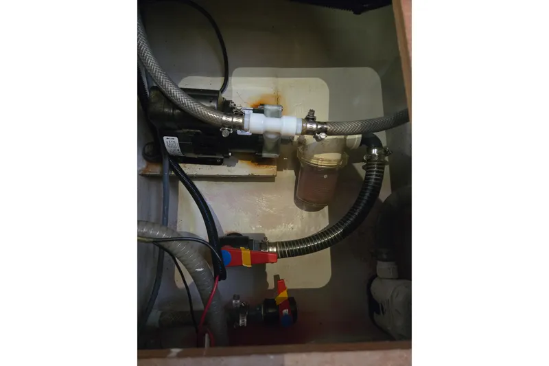 Slide: The Image of Engine compartment of 2018 Fountaine Pajot Helia 44 Evolution catamaran, showing hoses and fittings. - 52