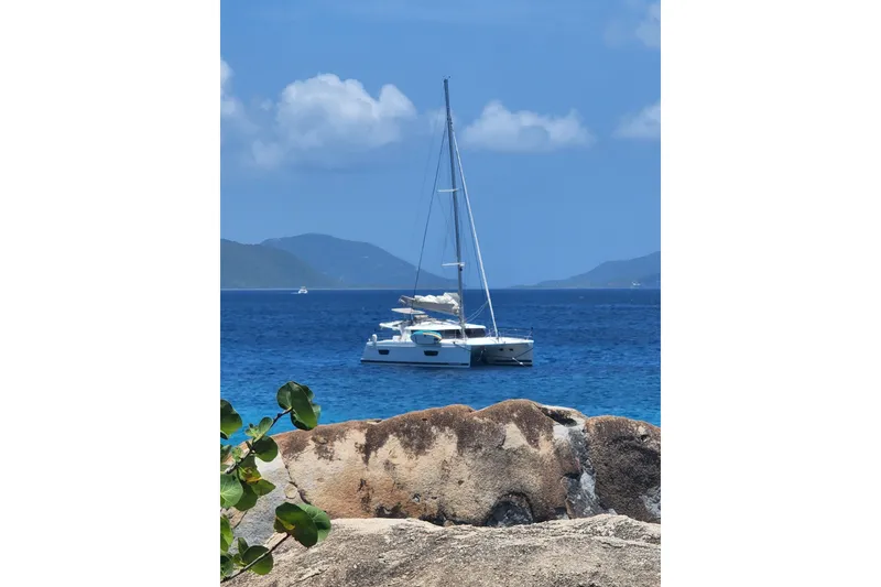 Slide: The Image of 2018 Fountaine Pajot Helia 44 Evolution catamaran sailing in clear blue waters. - 7