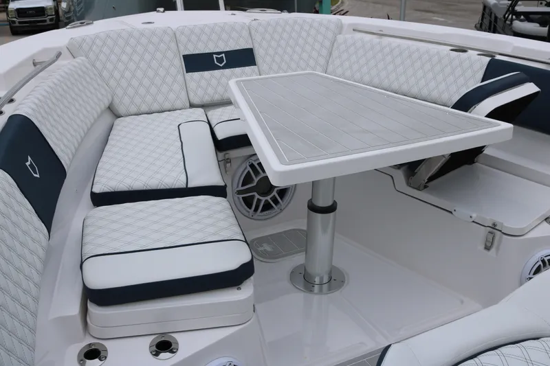 Slide: The Image of Luxurious seating area on 2026 Sea Fox 368 Commander boat with elegant table setup. - 11