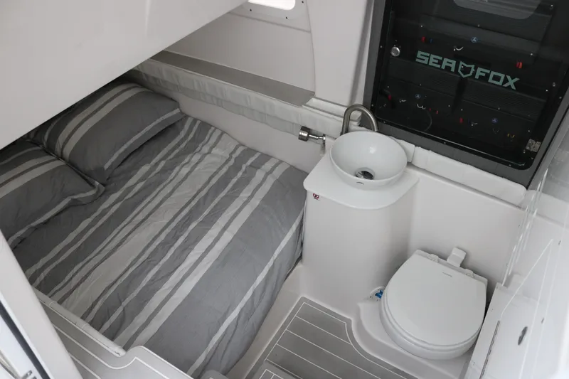 Slide: The Image of Interior cabin of 2026 Sea Fox 368 Commander with bed, sink, and toilet. - 15