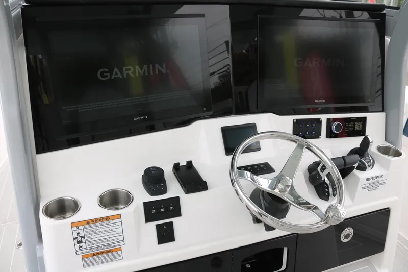 Slide: The Image of 2026 Sea Fox 368 Commander helm with dual Garmin displays and modern controls. - 16