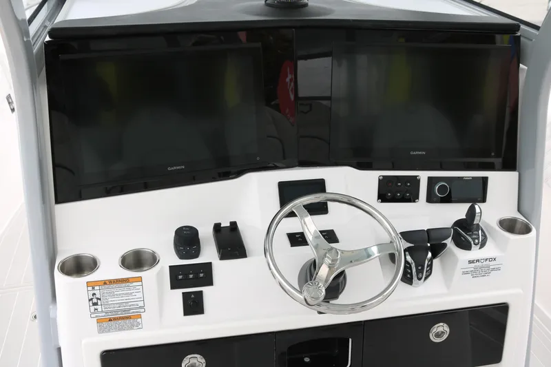 Slide: The Image of Helm of 2026 Sea Fox 368 Commander with dual Garmin displays and controls. - 17