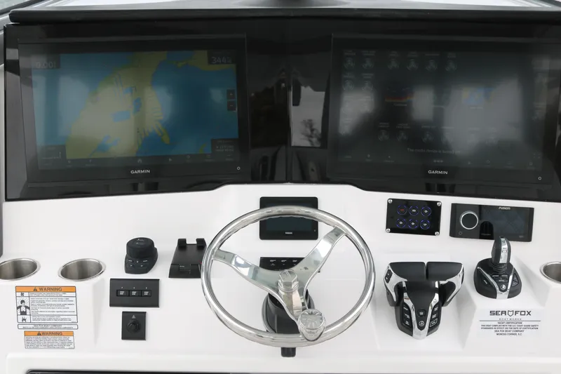 Slide: The Image of 2026 Sea Fox 368 Commander helm with dual Garmin displays and modern controls. - 18