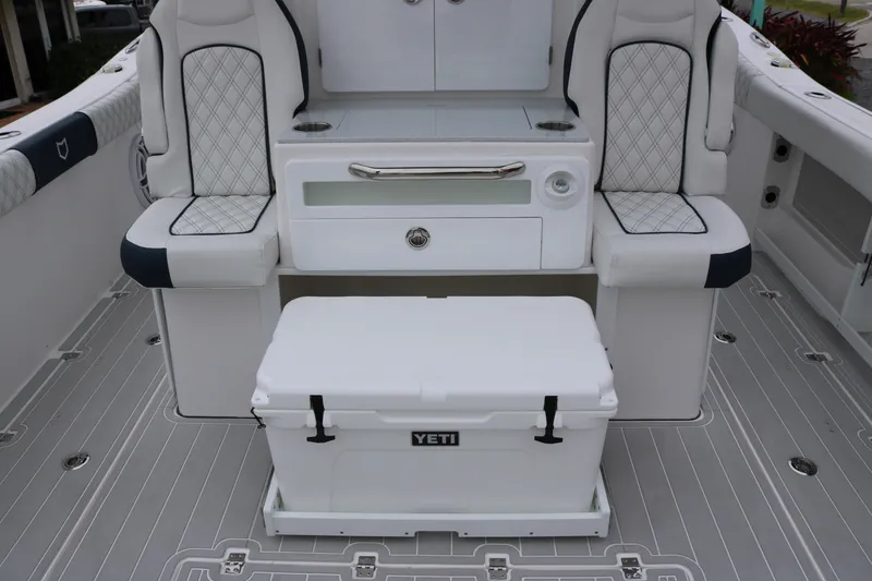 Slide: The Image of 2026 Sea Fox 368 Commander boat interior with seating and Yeti cooler. - 22