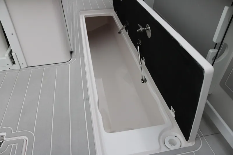 Slide: The Image of 2026 Sea Fox 368 Commander storage compartment with open lid on deck. - 25