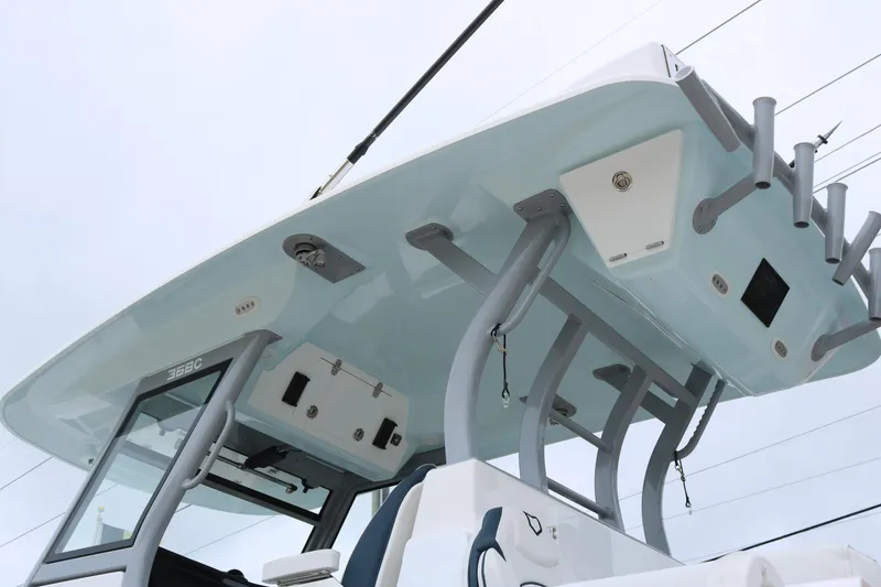 Slide: The Image of 2026 Sea Fox 368 Commander boat top view with rod holders and storage compartments. - 4