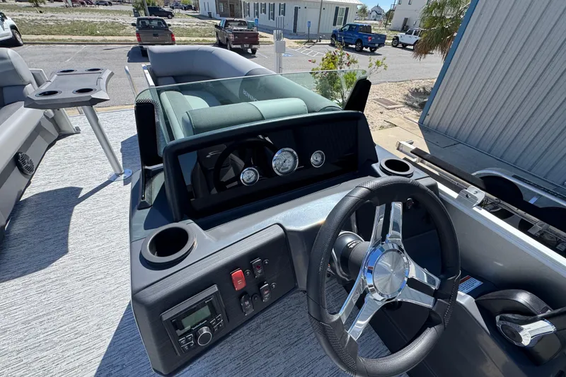 Slide: The Image of 2026 Bennington 22 SSB boat dashboard with steering wheel and control panel. - 10