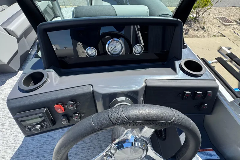 Slide: The Image of Steering console of 2026 Bennington 22 SSB boat with gauges and controls. - 11