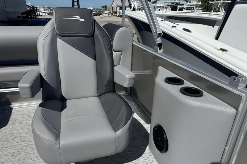 Slide: The Image of Captain's chair on 2026 Bennington 22 SSB pontoon boat with cup holders and speaker. - 13