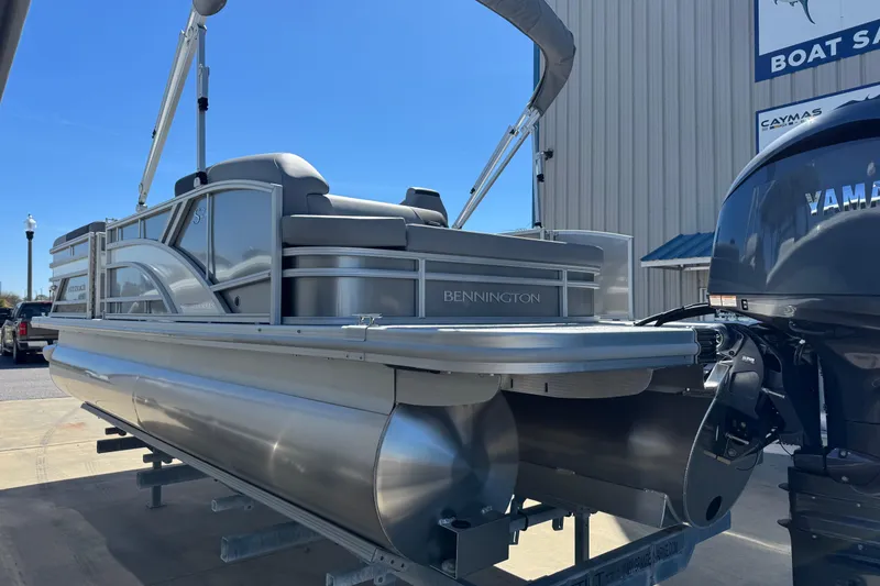 Slide: The Image of 2026 Bennington 22 SSB pontoon boat with Yamaha engine at a boat dealership. - 5