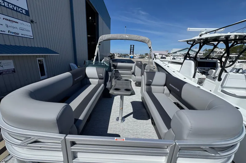 Slide: The Image of 2026 Bennington 22 SSB pontoon boat with spacious seating and modern design at a marina. - 7
