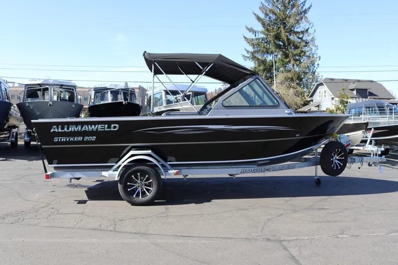 The Image of 2026 Alumaweld Stryker 202 boat on trailer, parked outdoors. - 0