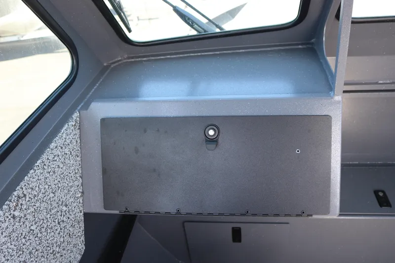 Slide: The Image of Interior view of 2026 Alumaweld Stryker 202 boat dashboard compartment. - 11