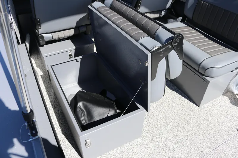 Slide: The Image of 2026 Alumaweld Stryker 202 boat interior with open storage compartment and seating. - 16