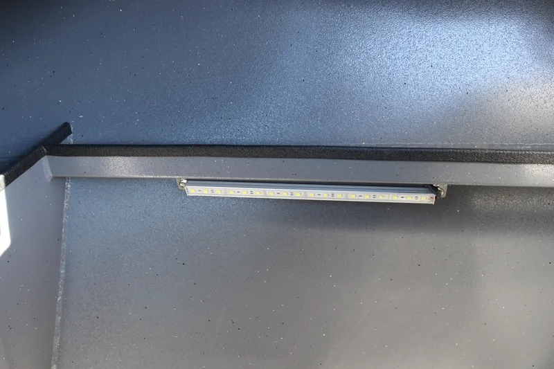 Slide: The Image of LED light fixture inside 2026 Alumaweld Stryker 202 boat interior. - 21