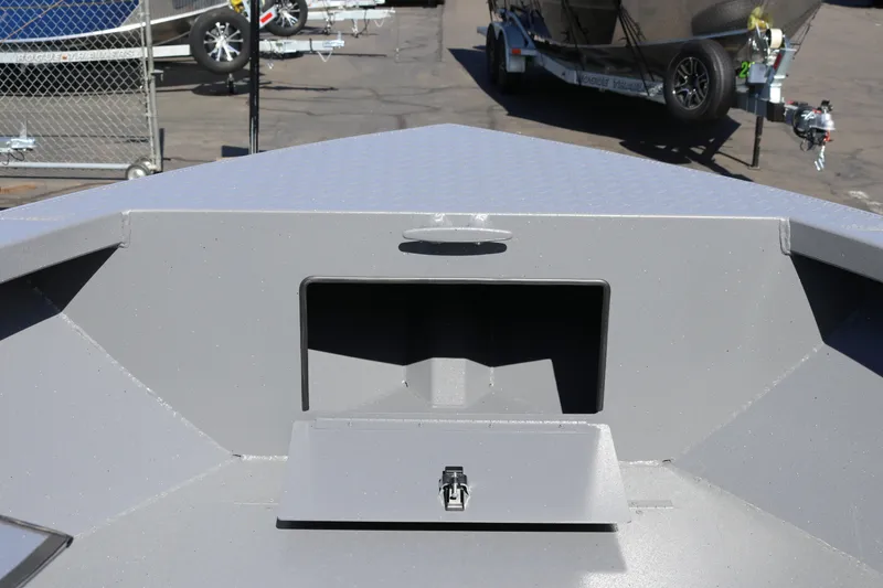 Slide: The Image of 2026 Alumaweld Stryker 202 boat interior with storage compartment, parked on trailer. - 25