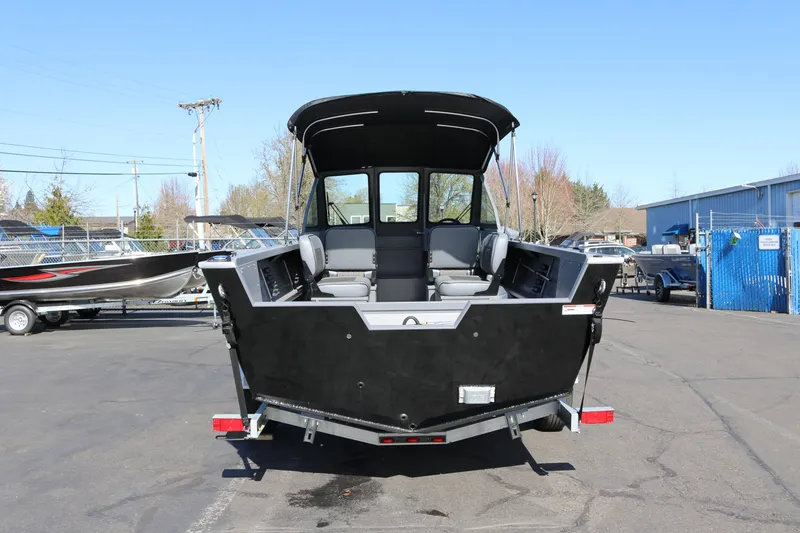 Slide: The Image of 2026 Alumaweld Stryker 202 boat, rear view, parked outdoors on a sunny day. - 3