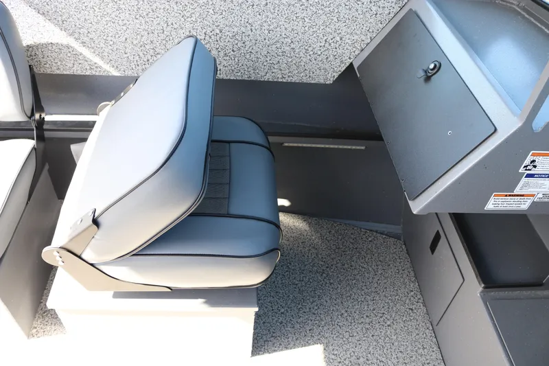 Slide: The Image of 2026 Alumaweld Stryker 202 boat interior with gray seating and storage compartment. - 31