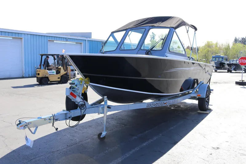 Slide: The Image of 2026 Alumaweld Stryker 202 boat on trailer in industrial setting. - 5