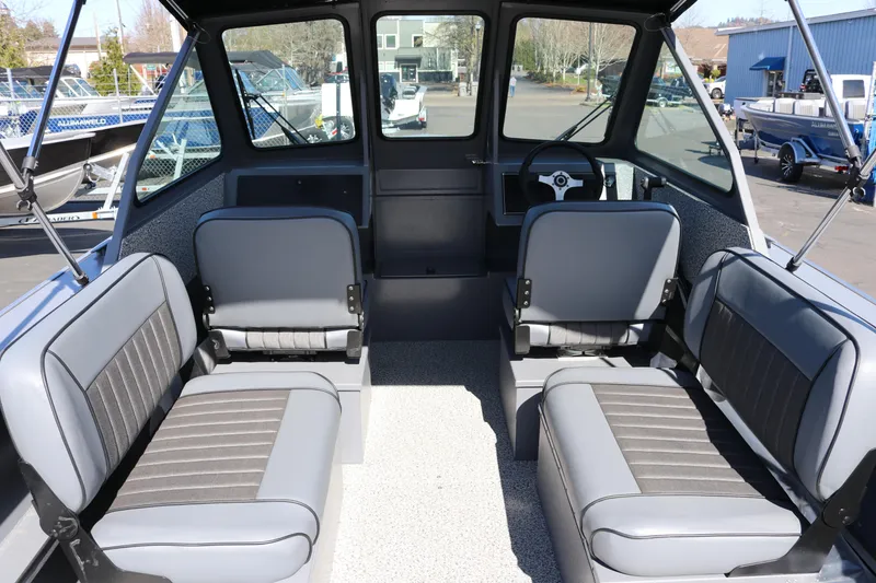 Slide: The Image of Interior of 2026 Alumaweld Stryker 202 boat with gray seating and steering wheel. - 8