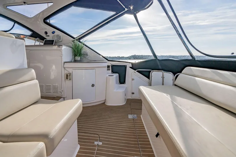 Slide: The Image of Luxurious interior of 2010 Regal Commodore 4460 yacht with elegant seating and panoramic windows. - 13