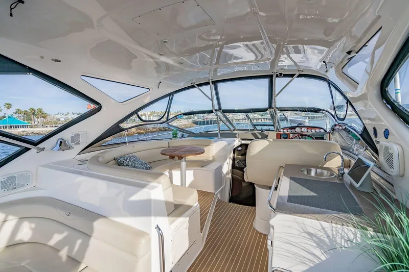 Slide: The Image of Luxurious interior of 2010 Regal Commodore 4460 yacht with seating and helm. - 18