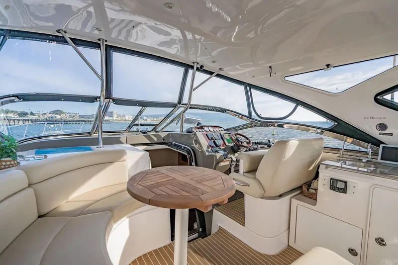 Slide: The Image of Luxurious interior of 2010 Regal Commodore 4460 yacht with panoramic windows and elegant seating. - 20