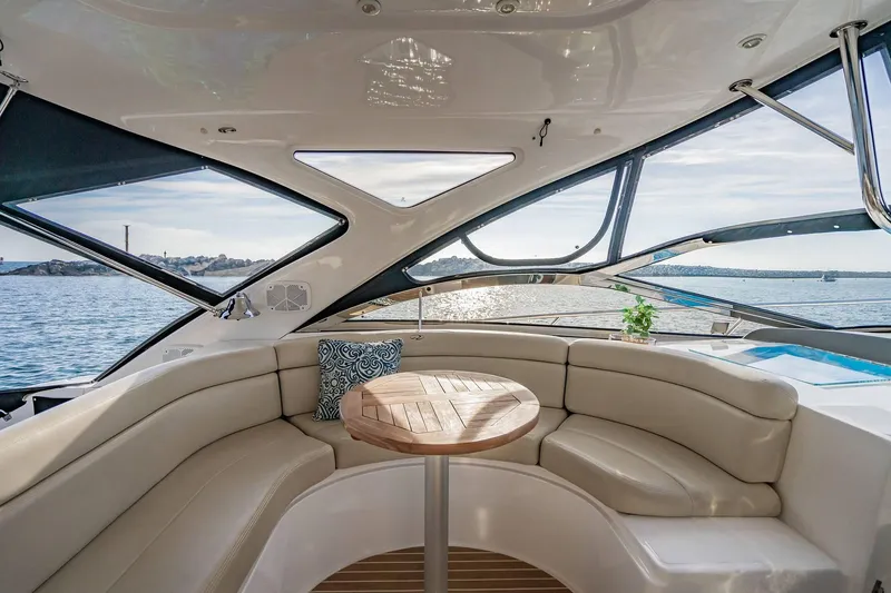 Slide: The Image of Luxurious interior of 2010 Regal Commodore 4460 yacht with ocean view and plush seating. - 22