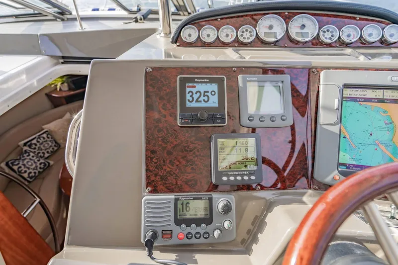 Slide: The Image of Cockpit of 2010 Regal Commodore 4460 with navigation instruments and controls. - 30