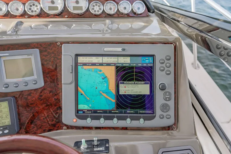 Slide: The Image of Boat dashboard with navigation system on a 2010 Regal Commodore 4460 yacht. - 31