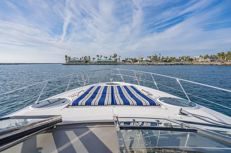 Slide: The Image of Bow view of 2010 Regal Commodore 4460 yacht on open water. - 37