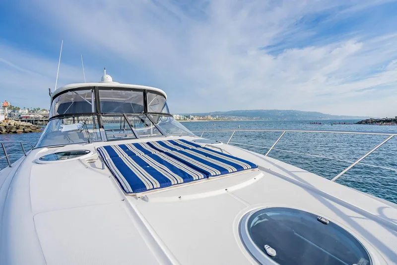 Slide: The Image of 2010 Regal Commodore 4460 yacht on calm sea with blue sky backdrop. - 39