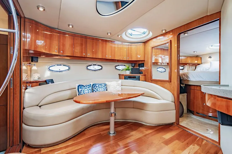 Slide: The Image of Luxurious interior of 2010 Regal Commodore 4460 yacht with elegant seating and wood finishes. - 43