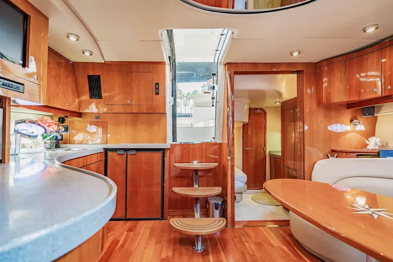 Slide: The Image of Luxurious interior of 2010 Regal Commodore 4460 yacht with wooden finishes and modern amenities. - 46